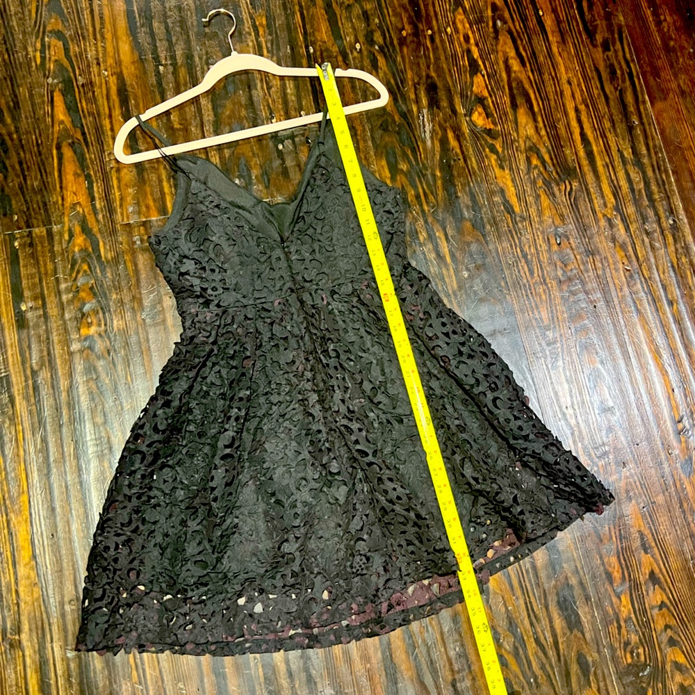 Black A-line filigree appliqué dress with mauve accents
